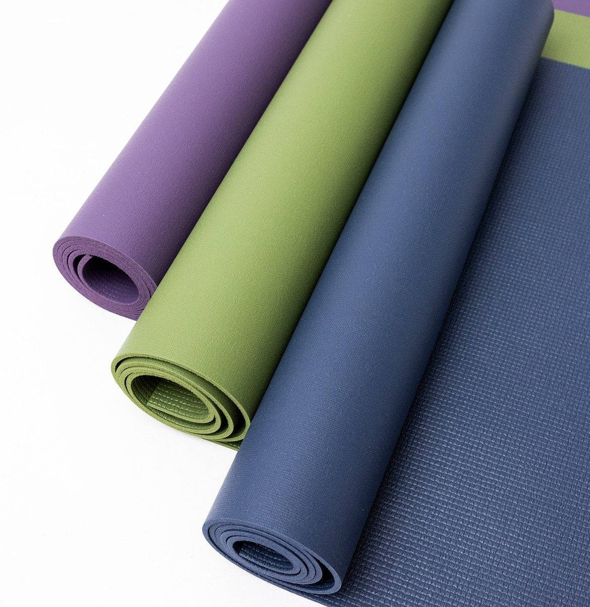 a group of yoga mats stacked on top of each other