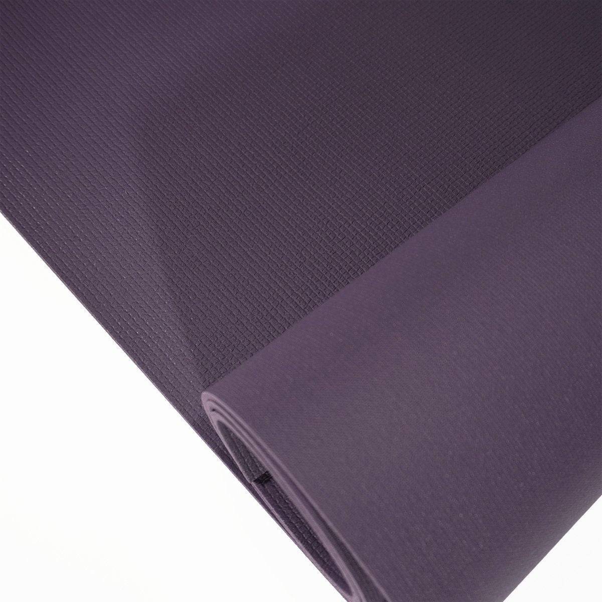 a purple yoga mat with a white background