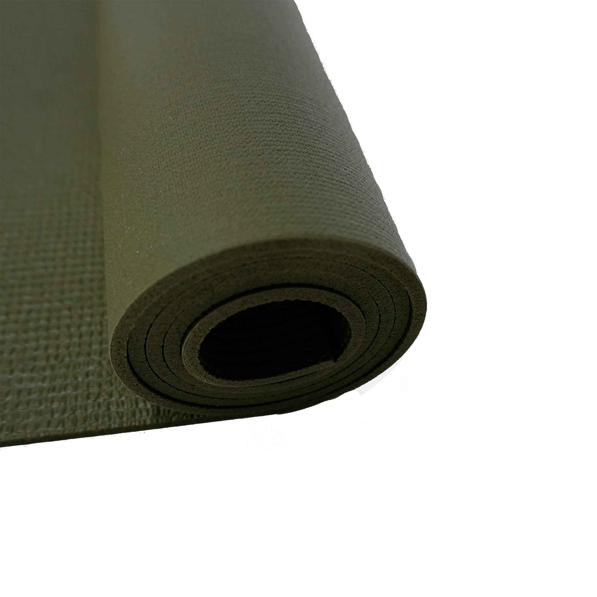 a rolled up yoga mat on a white background