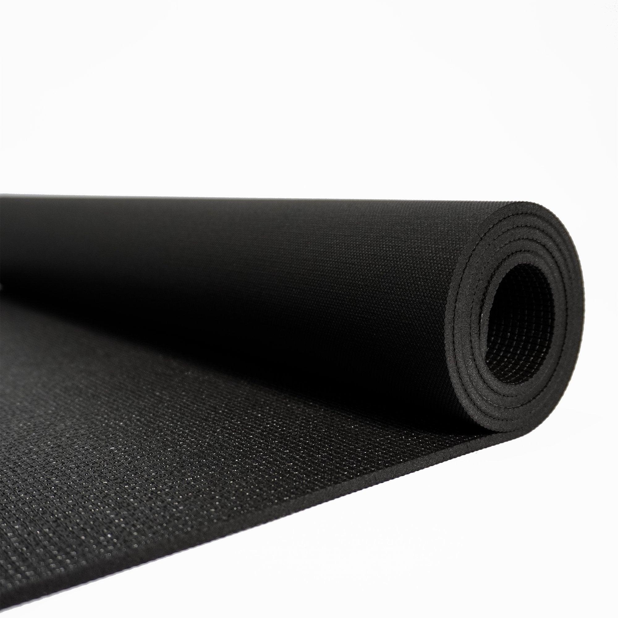 a black yoga mat on a white background