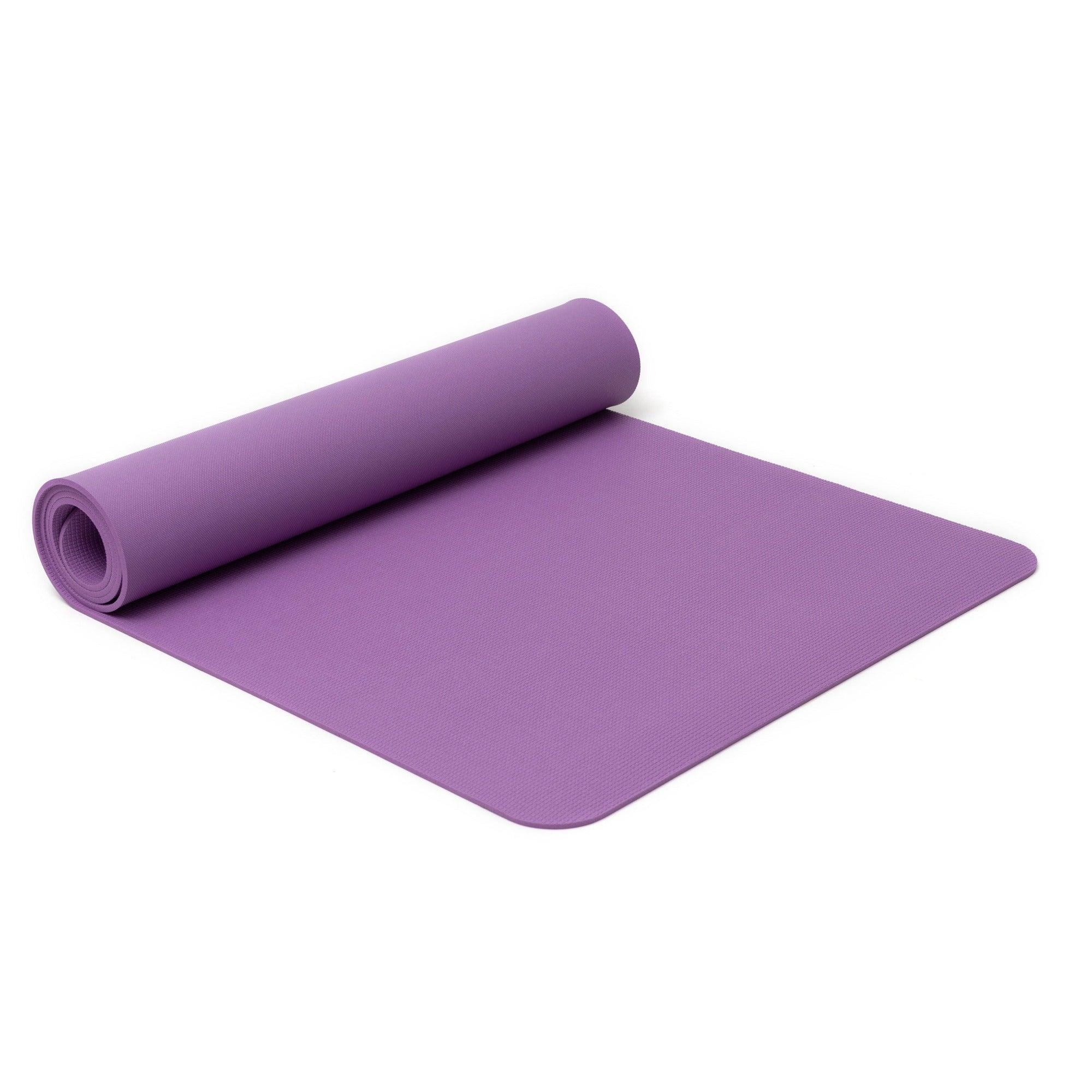 a purple yoga mat rolled up on a white background