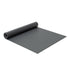 a roll of black yoga mat on a white background